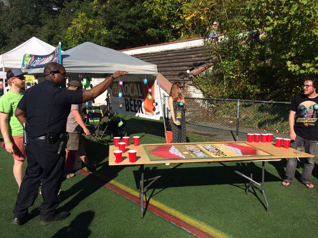 Who among us can resist the call? Even the APD is getting in on some pong at the <a href="/DigLocalAVL/">Dig Local Asheville</a> tent at <a href="/Brewgrass/">Brewgrass Festival</a>. #AVL