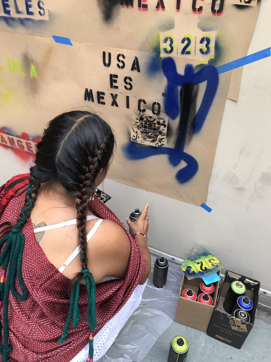 Woman painting stencil