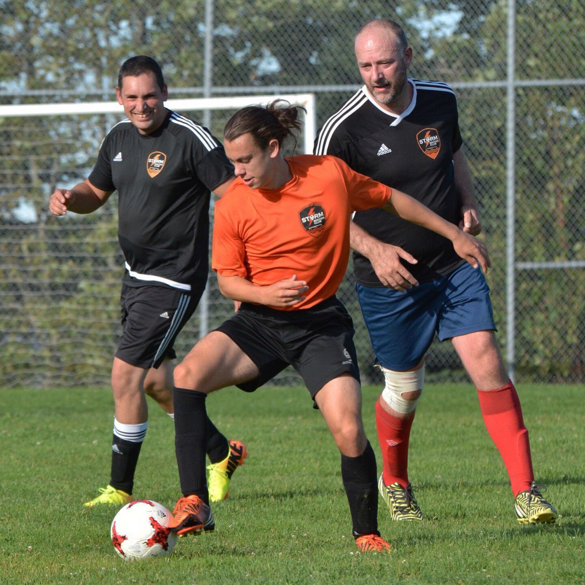 Storm_Soccer's tweet photo. U17A Oscar doesn't seem too bothered that Coaches Nick &amp; @markharper are breathing down his neck.(pic courtesy of @TracyLMac) #coachvsplayer https://t.co/xzFpTv19b9