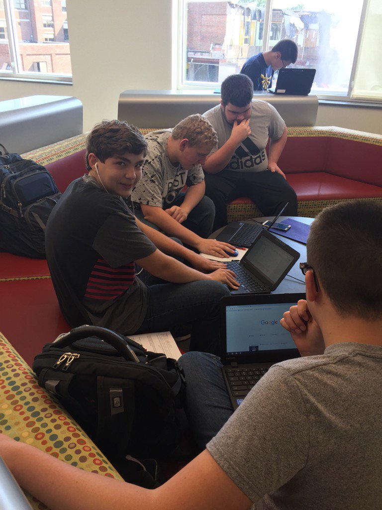 CantonLocal's tweet image. In the Design Center, a peer tutor helps guide homework being completed.