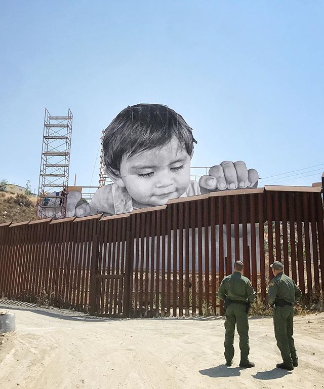 Image result for photos of French artist JR's intelation on the border divide