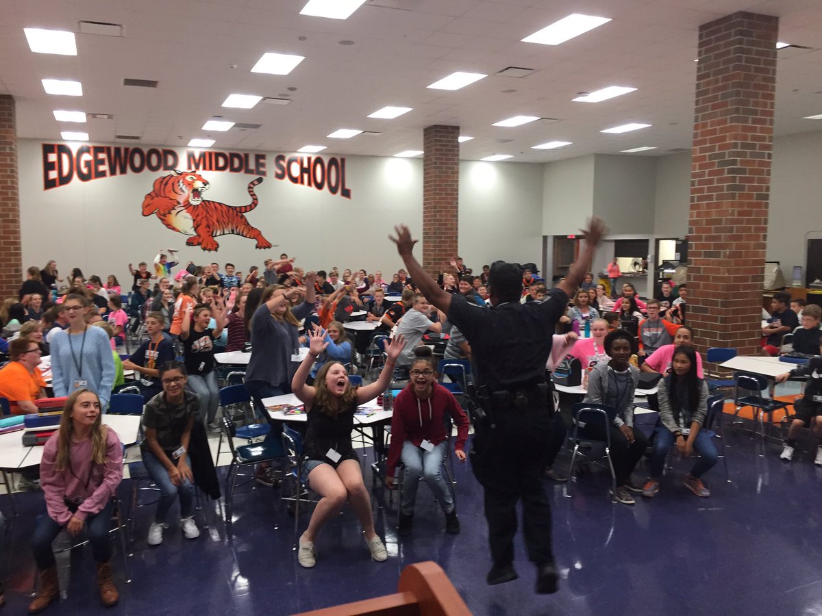 EKorreck's tweet photo. Officer Navarro getting the students pumped for the EMS vs LVMS football game! #schoolspirit #WCSMission @WCS_Edgewood https://t.co/DhX9K7zpNs