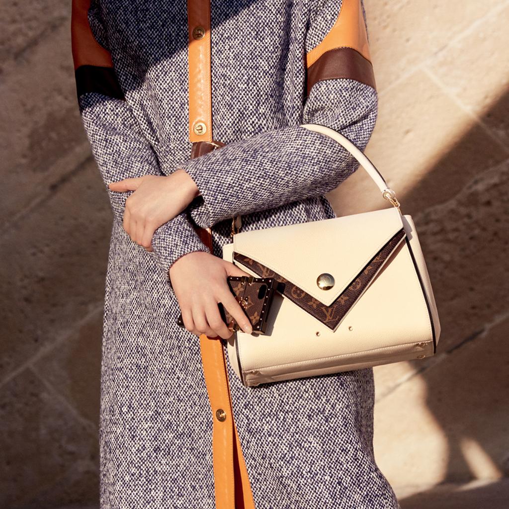 Louis Vuitton on X: City chic. The versatile Double V bag is