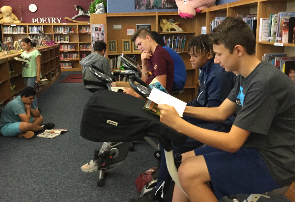 8th graders in the library... exercise bikes are popular! <a href="/SKMSFalcons/">Skyline Falcons</a>
