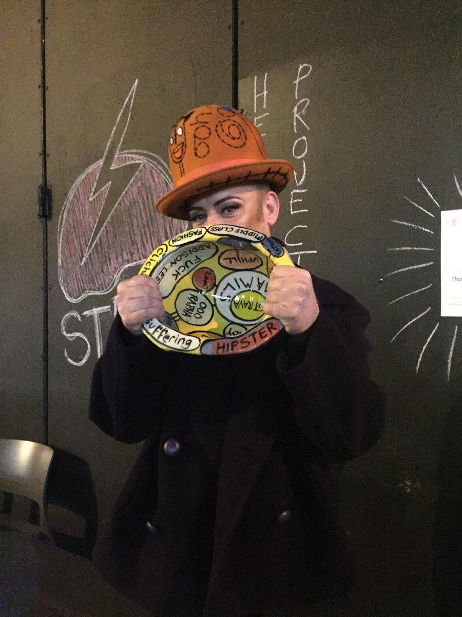 HeadwayUK's tweet photo. Thank you to the winner of the #GraysonPerry @Alan_Measles helmet @BoyGeorge an amazing 20k+ raised for BI survivors!!! @helmets4headway https://t.co/vXAPJvlFCb