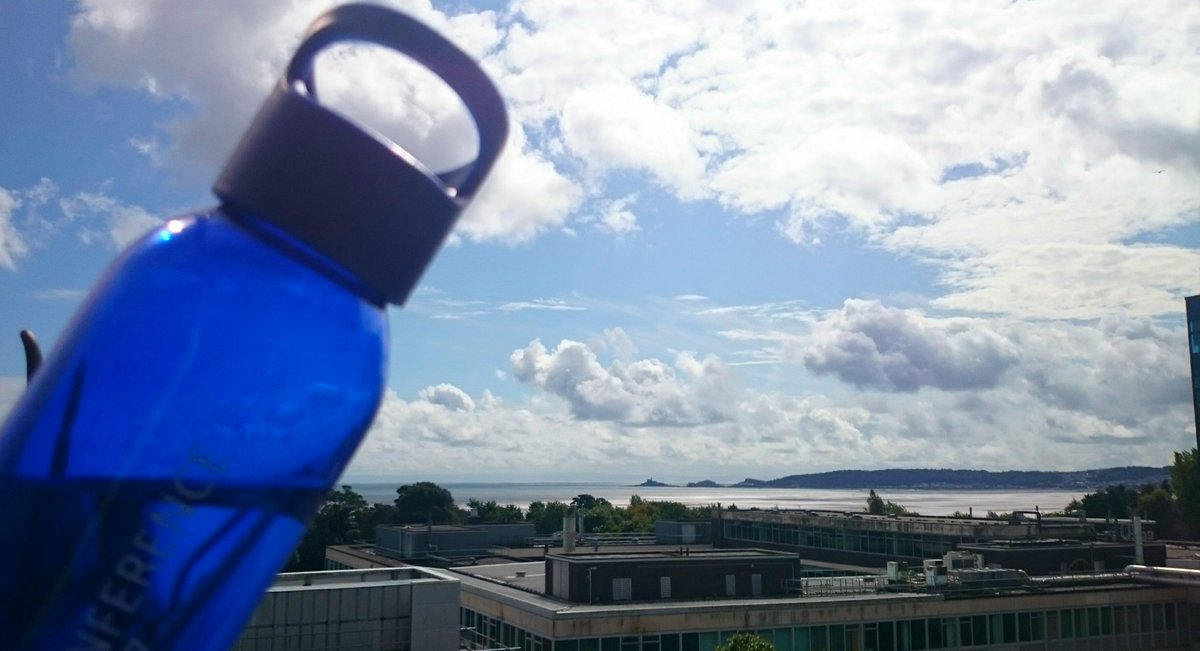 Helynk's tweet photo. My #ASET17 water bottle is helping as I catch up with emails. Not a bad view though is it? #StickingWithaTheme #Swansea https://t.co/tJaIoZhNEB