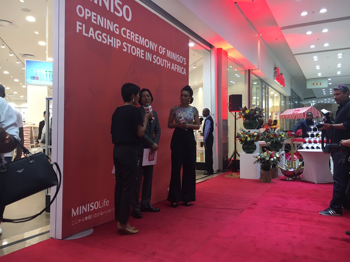Actress Pearl Thusi MC'ing the Miniso event.
