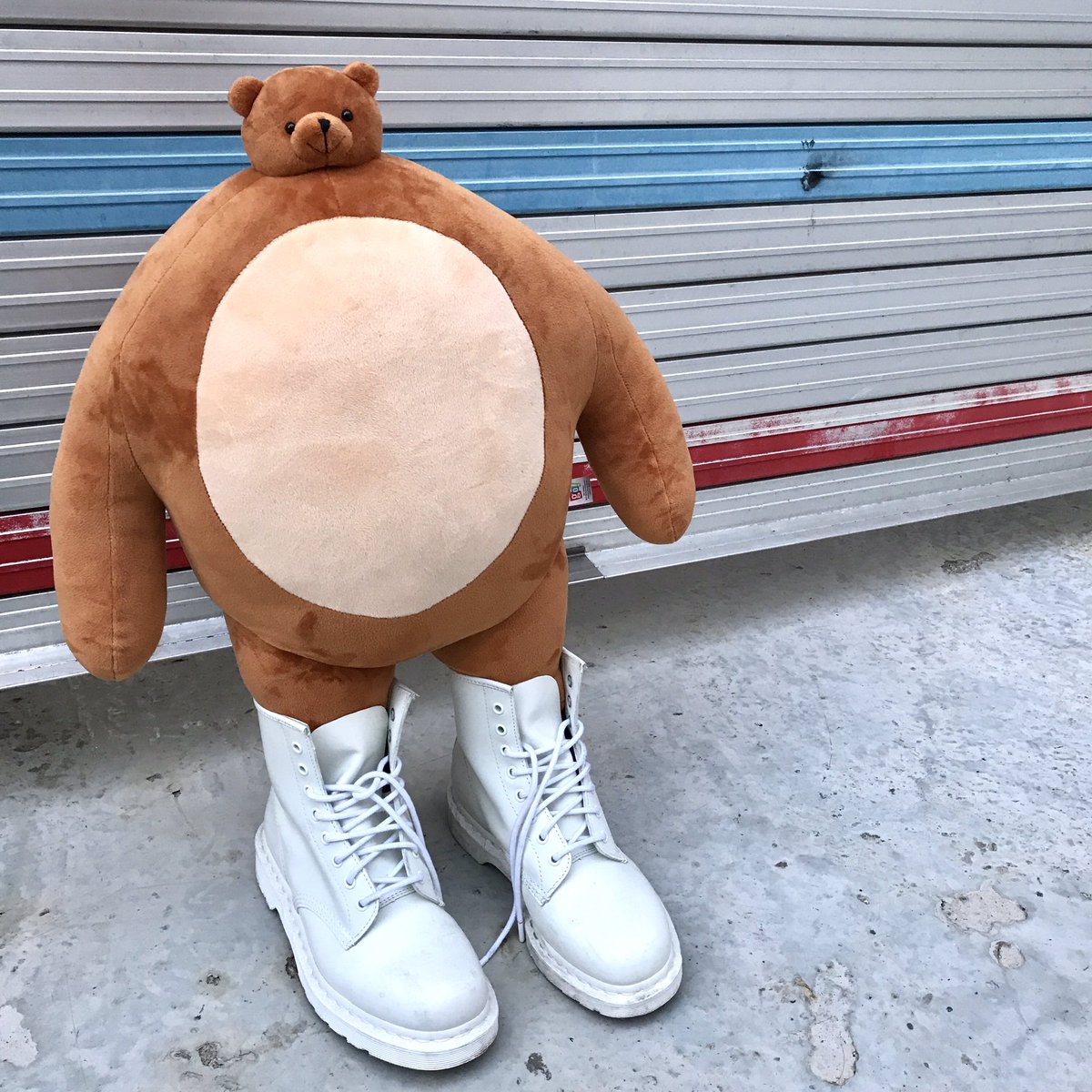 stuffed bear big body small head