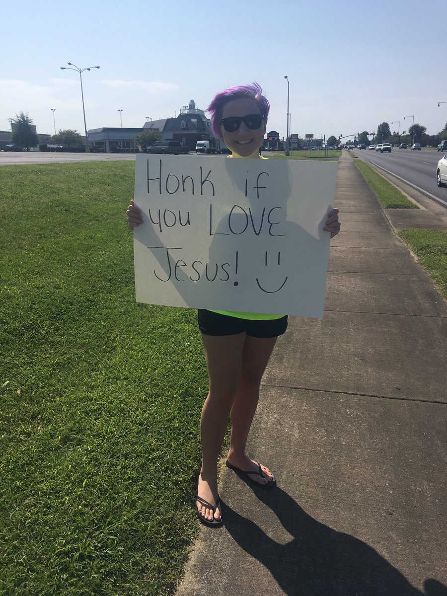 raleigh_jess's tweet photo. to the guy who flipped me off while i was holding this sign: church is sunday morning 10-12, sunday night 6-7 and wednesday night 7-8😌 https://t.co/Cyh7etRsZg