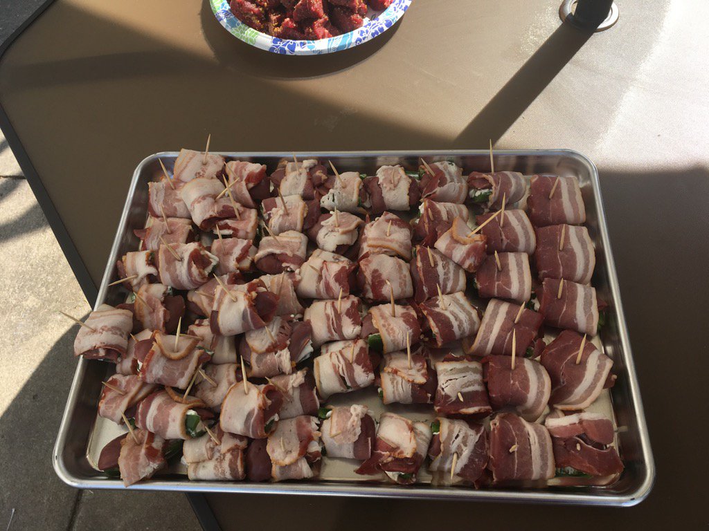 DustinFiner's tweet photo. Jalepenos, cream cheese, and dove, wrapped in bacon going on traeger. @PaulPabst @JonLapczenski @NRiedemann https://t.co/UoiXhqUNFa