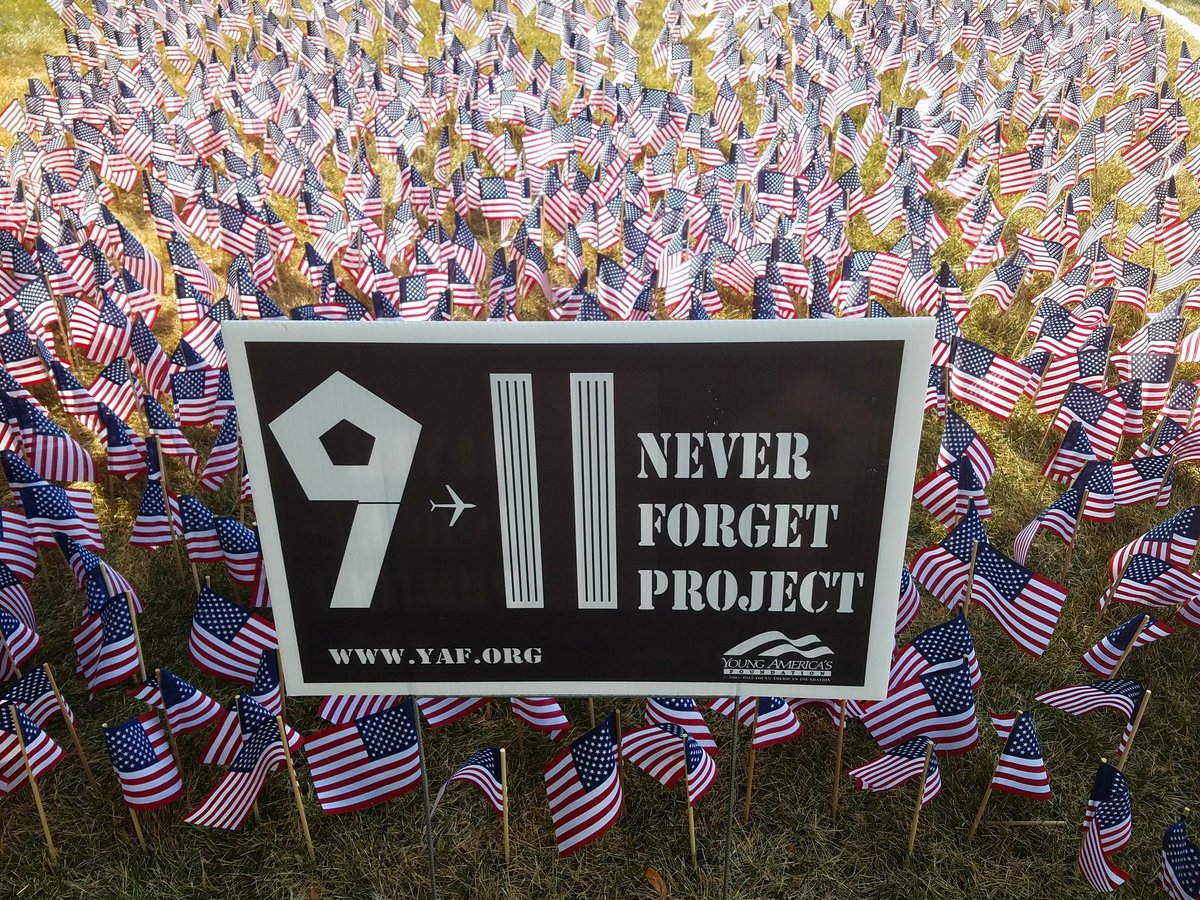 AlvernoCollege's tweet photo. Students placed 2,977 flags in the courtyard, one for each of the 9/11 victims. It's a stark reminder of the lives lost. #NeverForget https://t.co/NGqfa93YFz