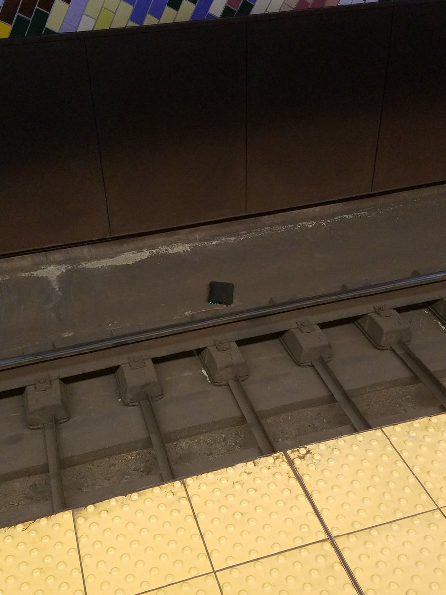 Virusrahl's tweet photo. @SEPTA looks like someone dropped a tablet on track 1 section A. 9/11/17 approx 445 pm. Down near the 11th street end. https://t.co/44FDtQBmFS