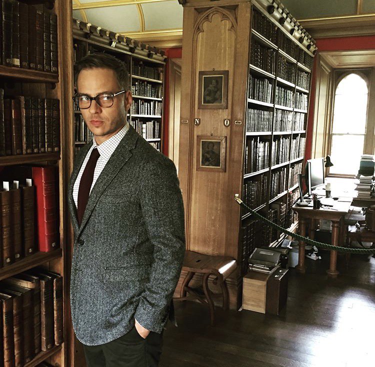 AU: A man is a professor of history and religion at a prestigious university, moonlighting as an assassin. (Photo from Tom's IG page)