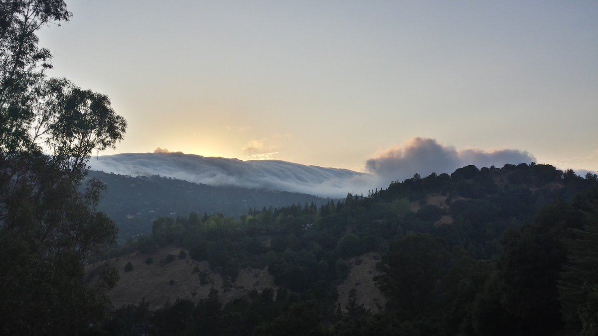 hughmann2's tweet photo. "Through the #eyes of a #friend:"   "#Sunset as the #clouds pour over the #mountains." https://t.co/74CdM46aVy