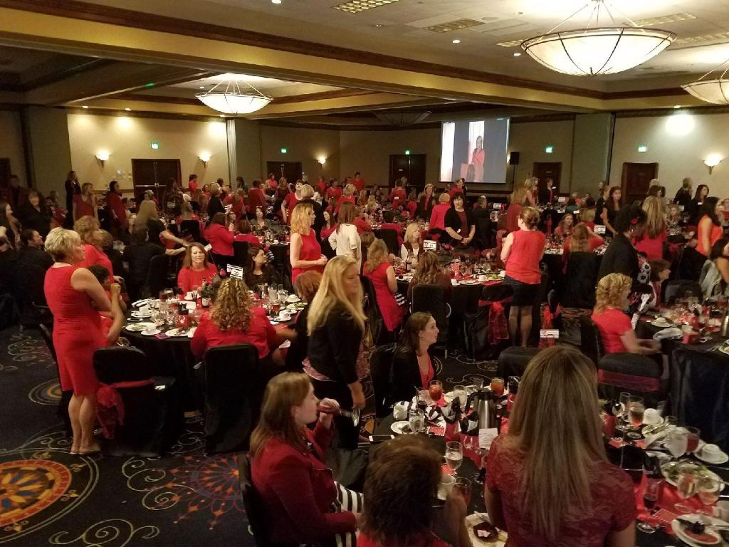AHAMissouri's tweet photo. 1 in 3 women stand in the ballroom at #GoRedJeffCity to represent the impact of heart disease and stroke. https://t.co/Z9P0ZOtCZk