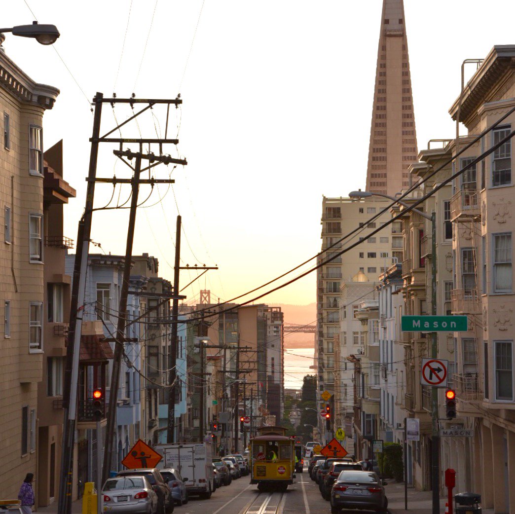 Beautiful #sfmuni #morning at the #cablecar barn. Car 15 heads out into the #sunrise. #transamericapyramid #nobhill