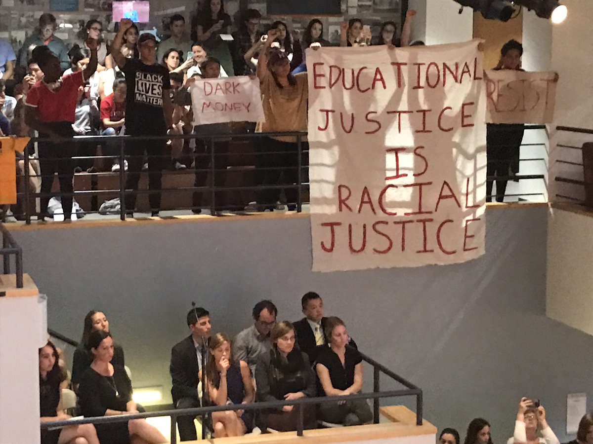 CoreyWelford's tweet image. More silent protestors at Harvard. #SecDeVosForum
