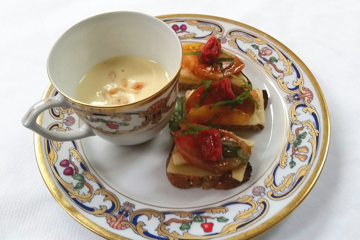 Cauliflower cappuccino with hazelnut, and open-faced heirloom  tomato sandwich with raw milk Gouda and basil chiffonade.<a href="/LesNomadesChi/">Les Nomades</a>