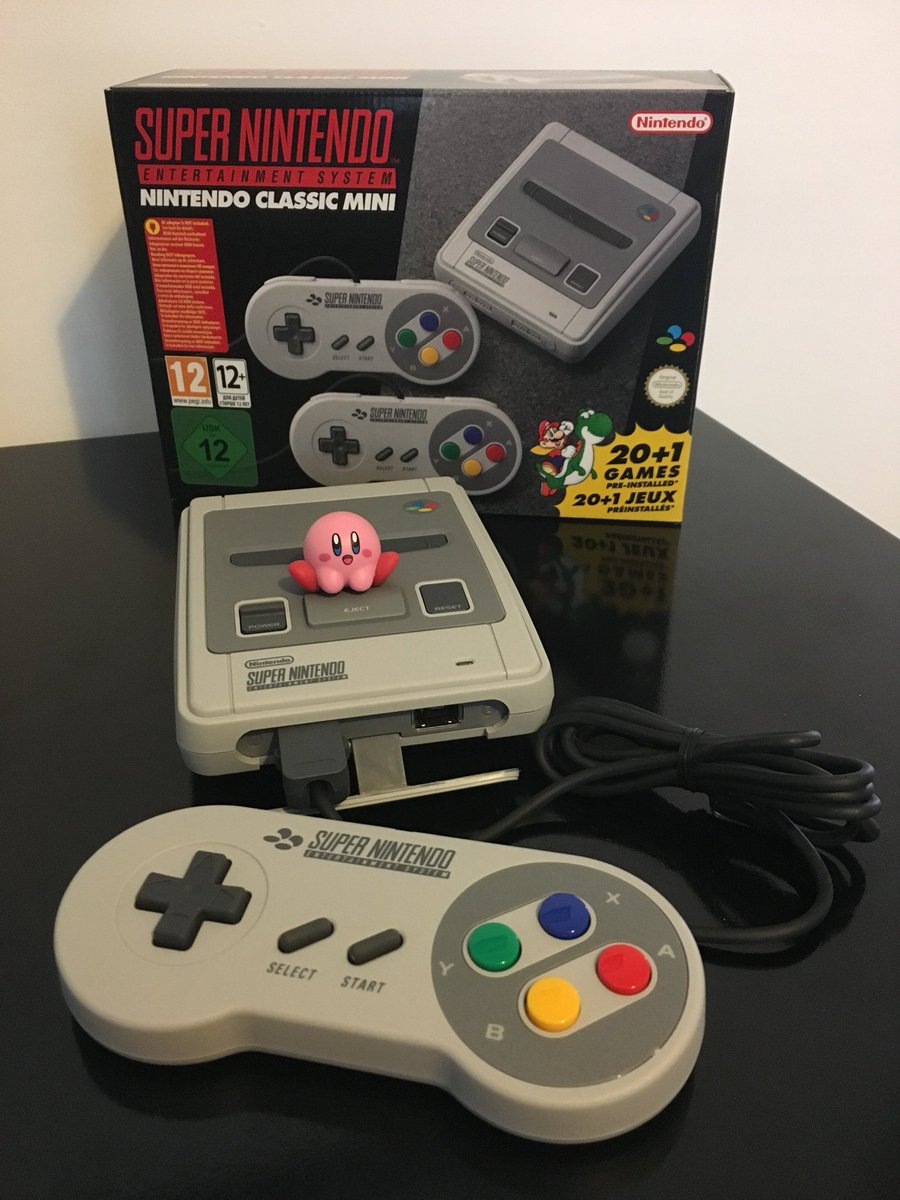 TheAvgGamer's tweet image. Yay, our #SnesMiniClassic has just arrived. Tiny Kirby has already taken a shine to it. First impressions: It’s really, small, uses a micro-USB cable for power and looks a bit less elegant when you connect up the joypads, as you have to remove the replica SNES connector cover.