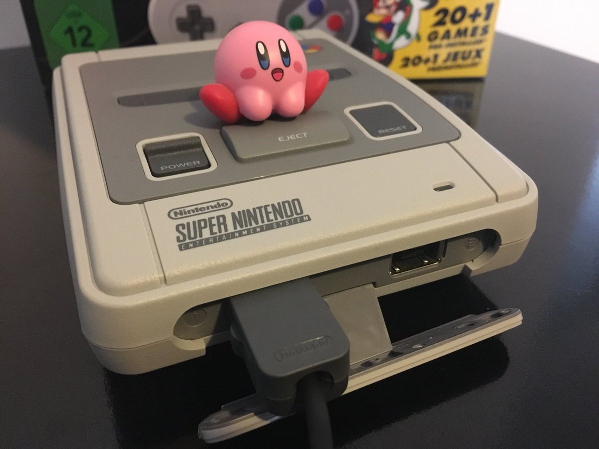 TheAvgGamer's tweet image. Yay, our #SnesMiniClassic has just arrived. Tiny Kirby has already taken a shine to it. First impressions: It’s really, small, uses a micro-USB cable for power and looks a bit less elegant when you connect up the joypads, as you have to remove the replica SNES connector cover.