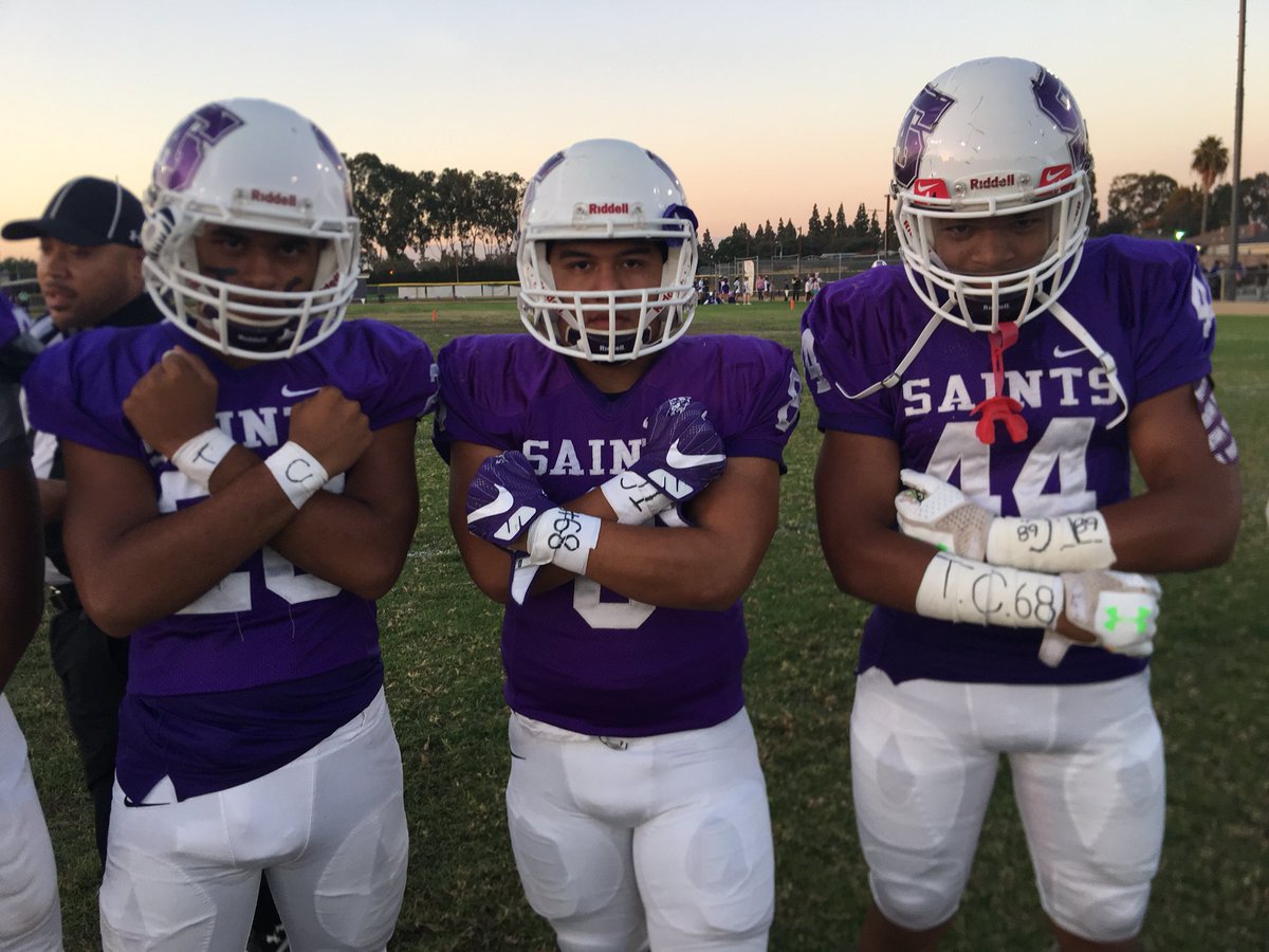 StAnthonySAINTS's tweet photo. Some of the #SAHS Football players are honoring Tim Johnson on the field tonight. #ForTC https://t.co/CAze44DySz