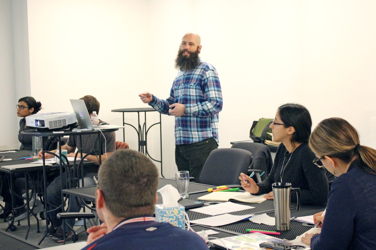 Start small when introducing critiquing skills at your organization. - <a href="/adamconnor/">Adam Connor</a> teaching students at <a href="/CenterCentre/">The UX Design School</a>