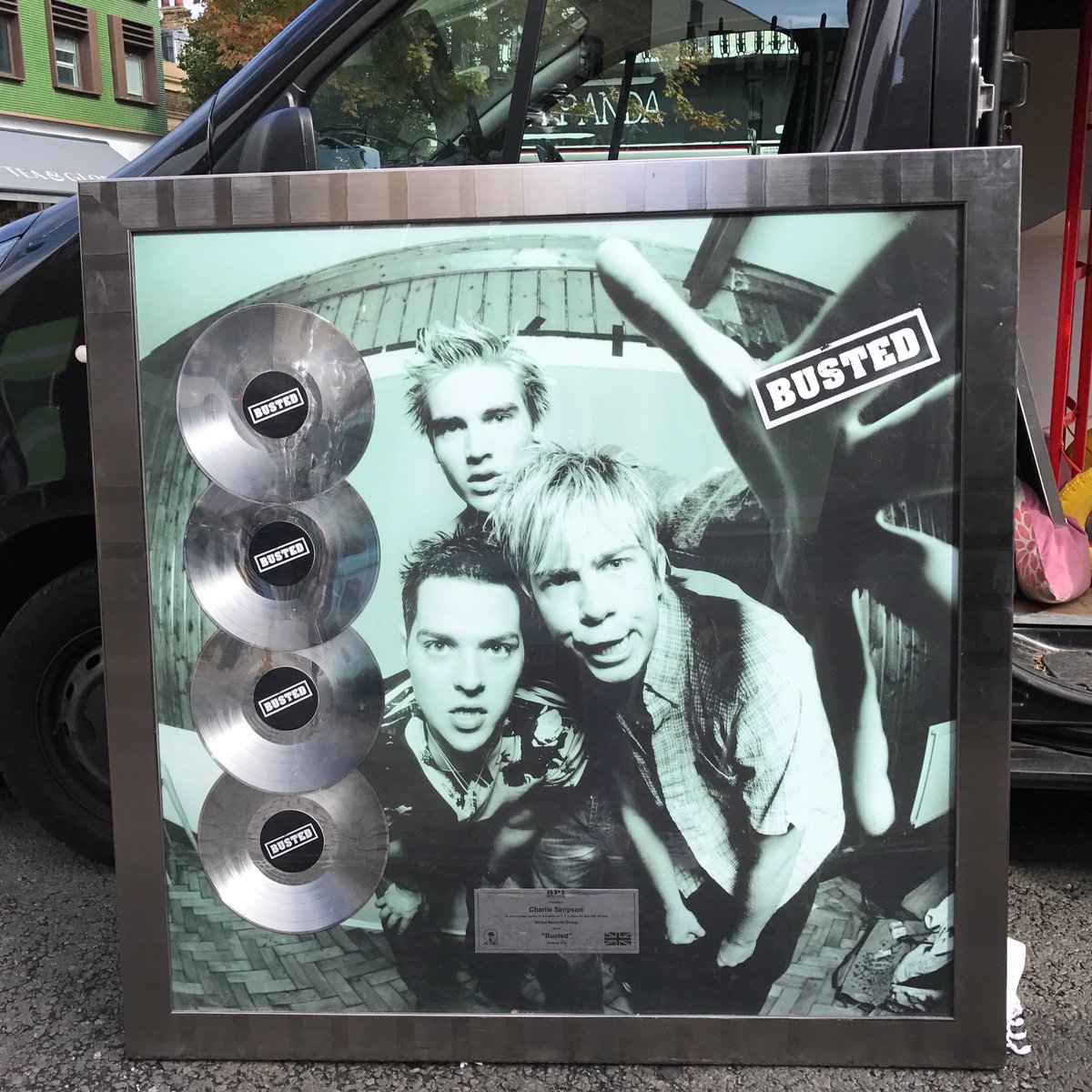 Busted's tweet photo. The last display from the #BUSTEDest2002 pop up is going home 🏡😢Til next time! 💿💿💿 #XV https://t.co/FfP7HYDeYc