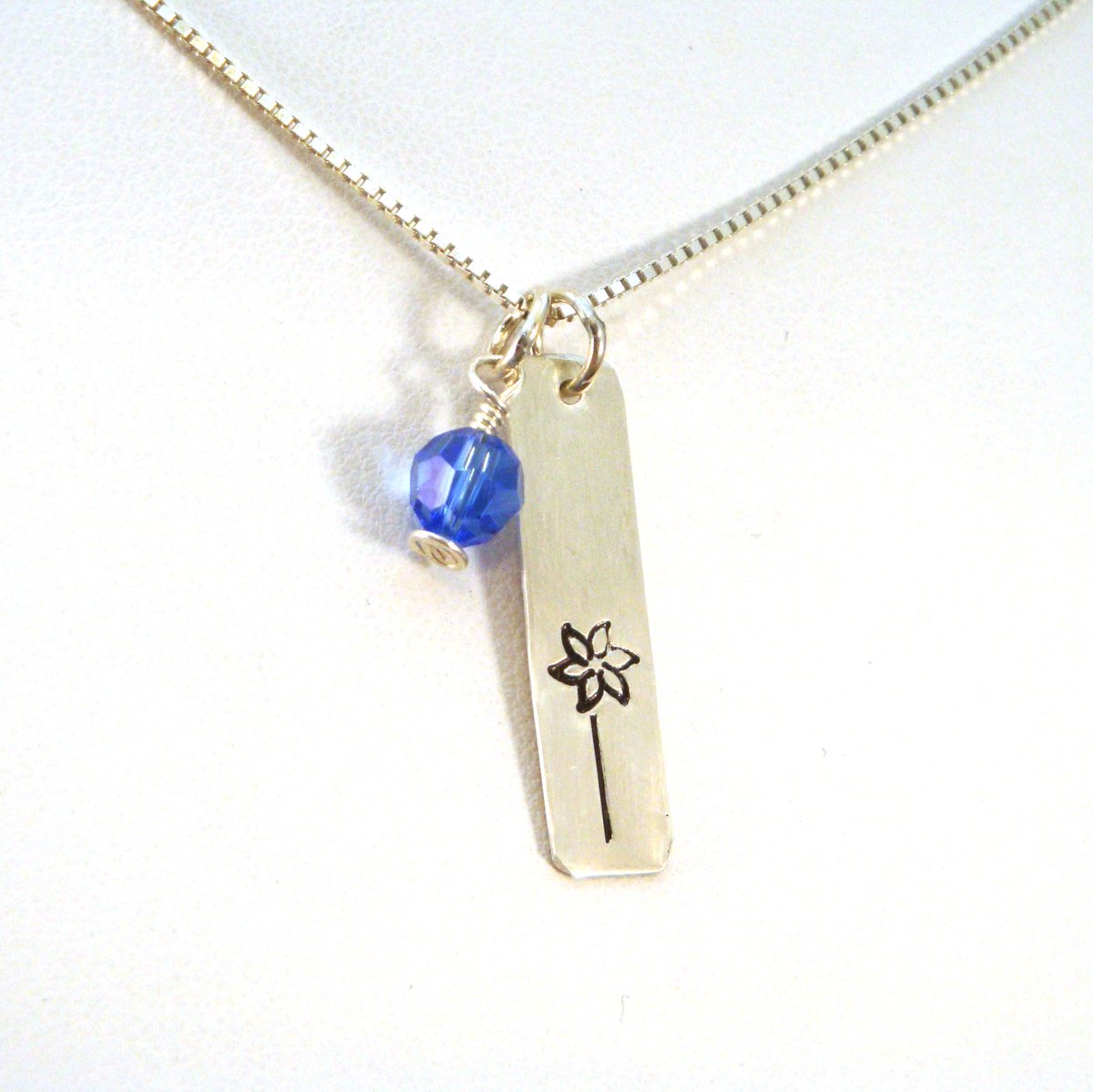 Pinwheel necklace with blue crystal for Child Abuse Awareness crowstealsfire.com/child-advocacy… #socialwork #stopchildabuse #survivorcommunity