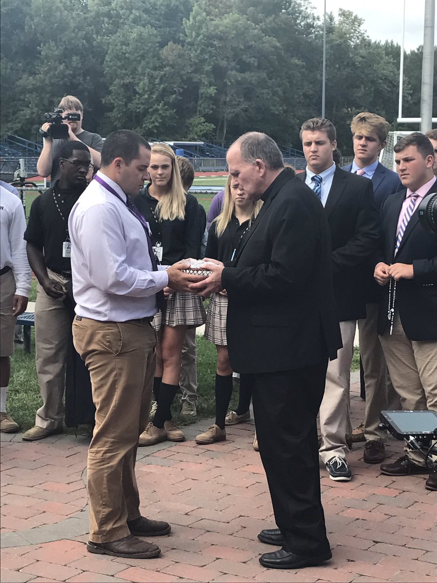 .@TrentonDiocese Bishop O'Connell blesses pins for #DOTCAC student-athletes participating in today's leadership summit.