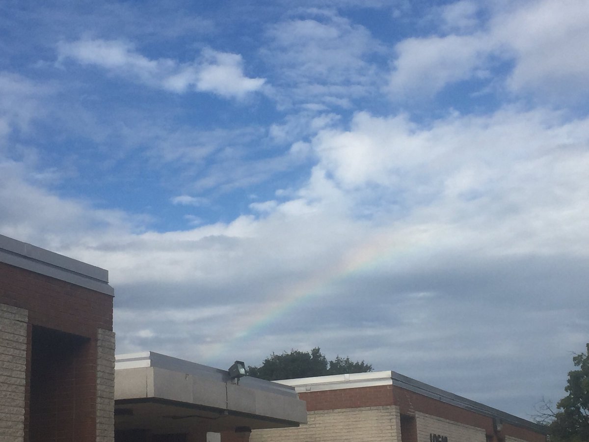 debbie_claridge's tweet photo. A rainbow peeking through the clouds @ Logan Elementary this morning 🌈 https://t.co/0JjXjp5U19