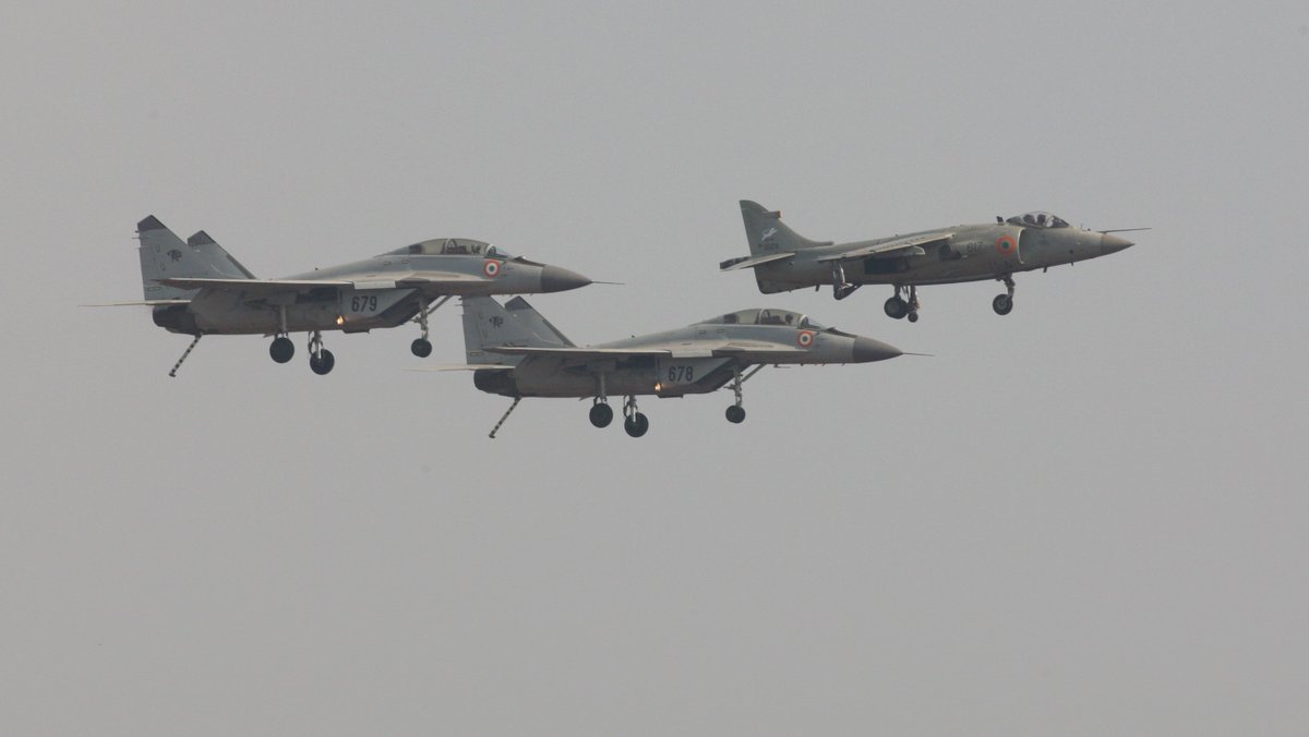 Retirement of the Sea Harrier - one last flight, into the sunset, escorted by the next generation!  #Poignant