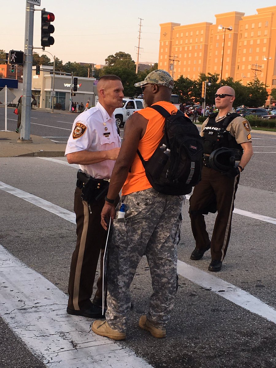 alexiszotos's tweet photo. Just like he did in #Ferguson Lt. Jerry Lohr is helping create conversation, ease tension between police and protesters. #STLverdict https://t.co/3heDx4Dtxy