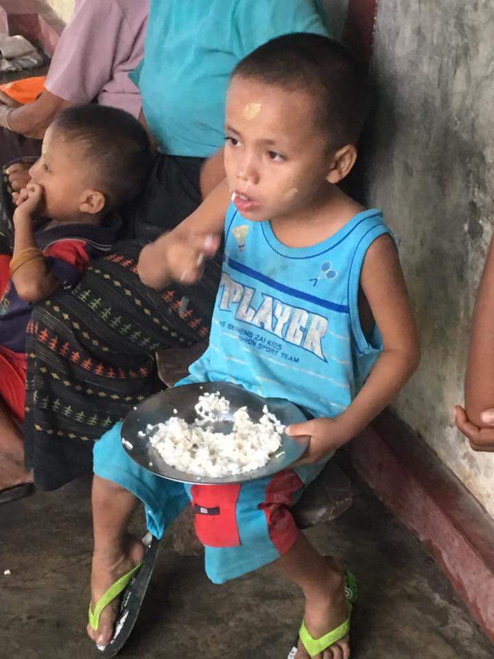 This is a Rahine innocent child who has fled his village. We Myanmar children do not lie n cry. He is eating rice only.  West only pity lies