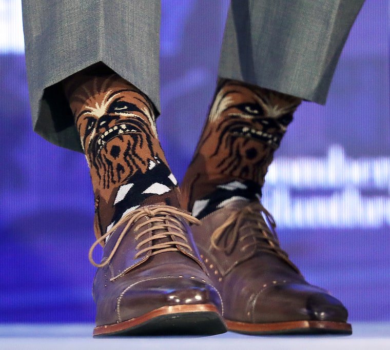 tomandlorenzo's tweet photo. Justin Trudeau wears Chewbacca socks at the #BloombergGBF https://t.co/6YNvIf7mkR