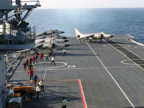 Mother ship lined up facing the wind, the Harrier taxies out for a take-off run!