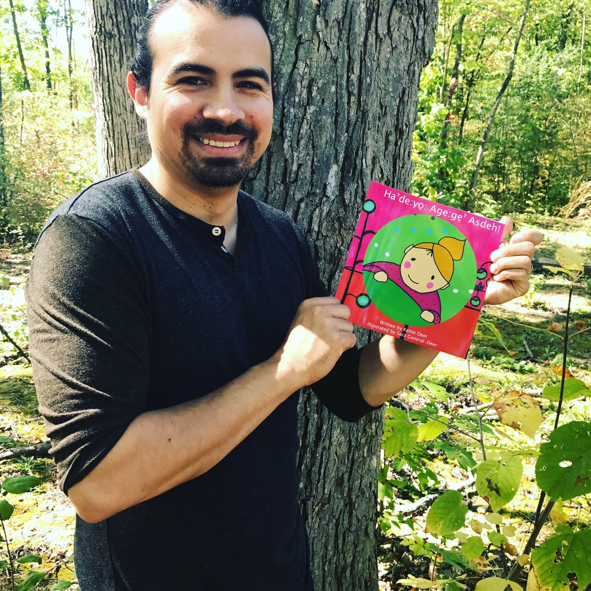 Kehte with his first language book, Ha'de:yǫ' Age:gę' Asdeh! #Ogwehowehneha #IndigenousReads