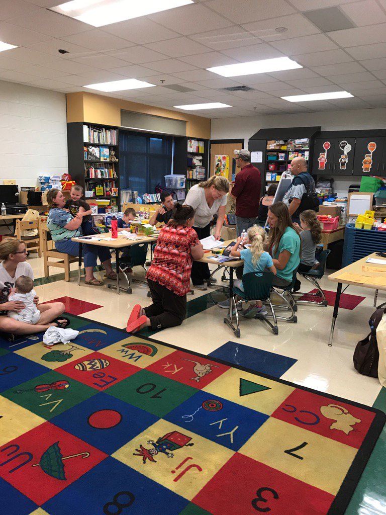 EMES Preschool parents engage with their children during the Literacy at Home night.