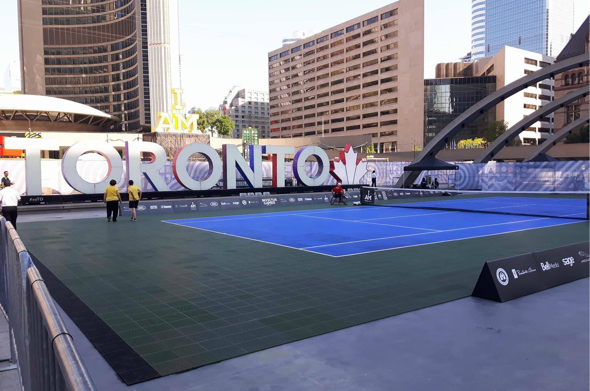 blogTO's tweet photo. Nathan Phillips Square just got tennis courts https://t.co/3X5s59rEqC https://t.co/nnJtpy83Oe