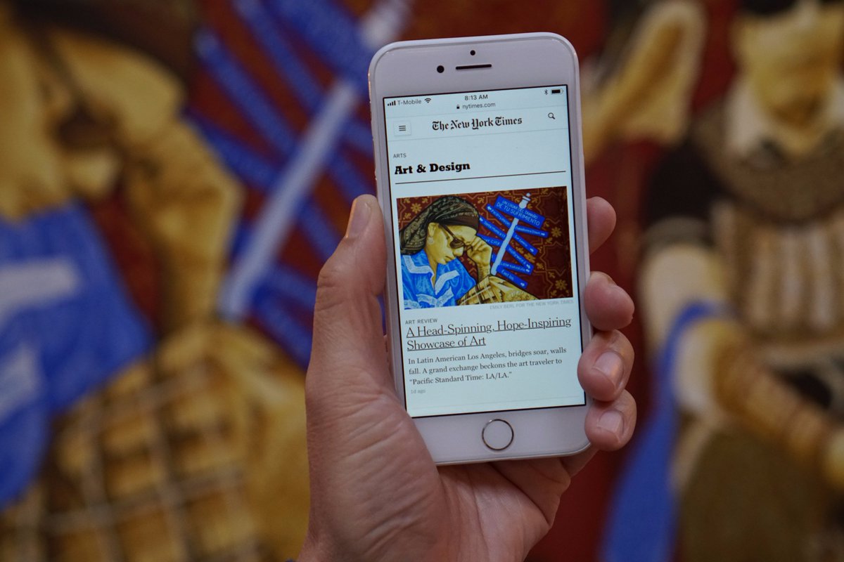 Cell phone with NY Times article about Visualizing Language on screen.