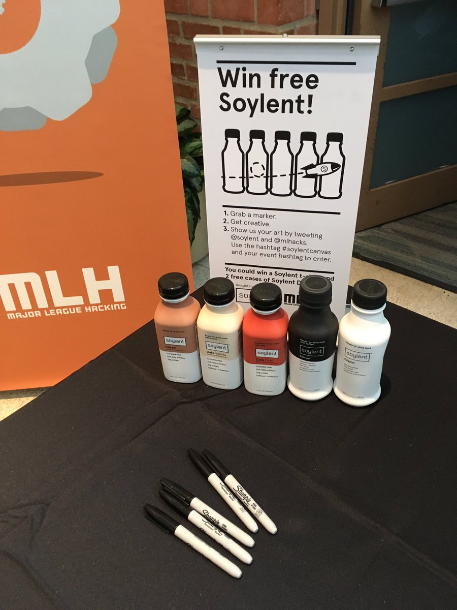 MLHacks's tweet photo. We're ready @hack_rice. Come say 👋 at our table and grab @soylent and join us our drawing contest! #hackrice https://t.co/yVG3ZQr4Bd