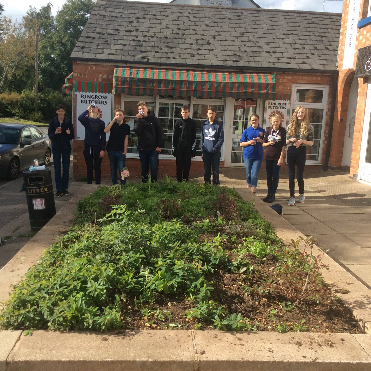 Before and after! A group of pupils weeded the flower bed in Broughton which they planted before the holidays.4 bags later.....