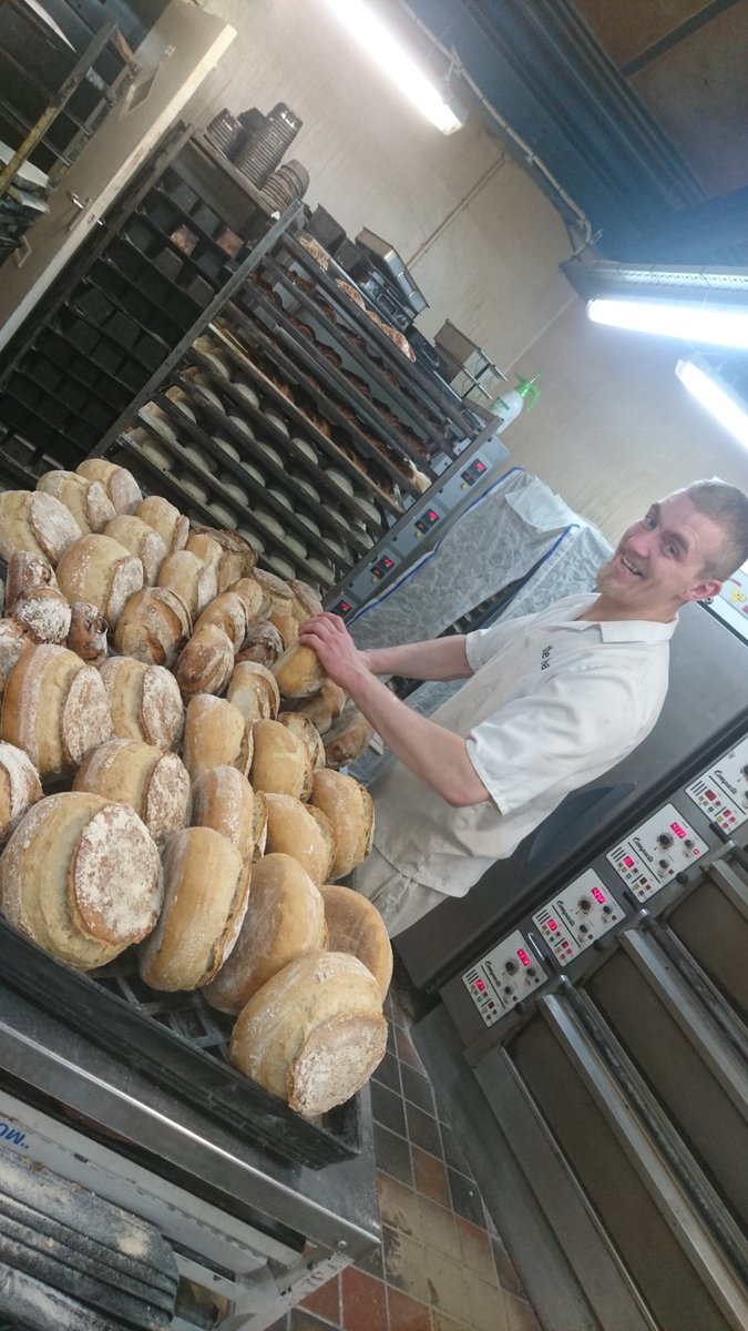 Our Polish ovensman, Adrian looks pleased with his work, as well he might. Lovely looking light rye and fig bread. #realbread