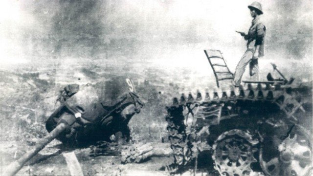 A VPA officer standing on the ruins of a Chinese tank in Cao Báng on 07 March 1979