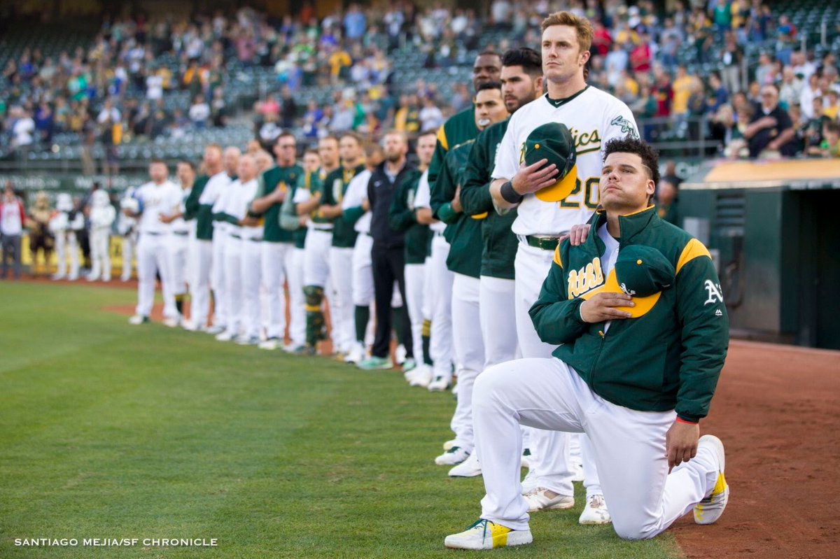 Bruce Maxwell of loser Oakland A's takes a knee during anthem