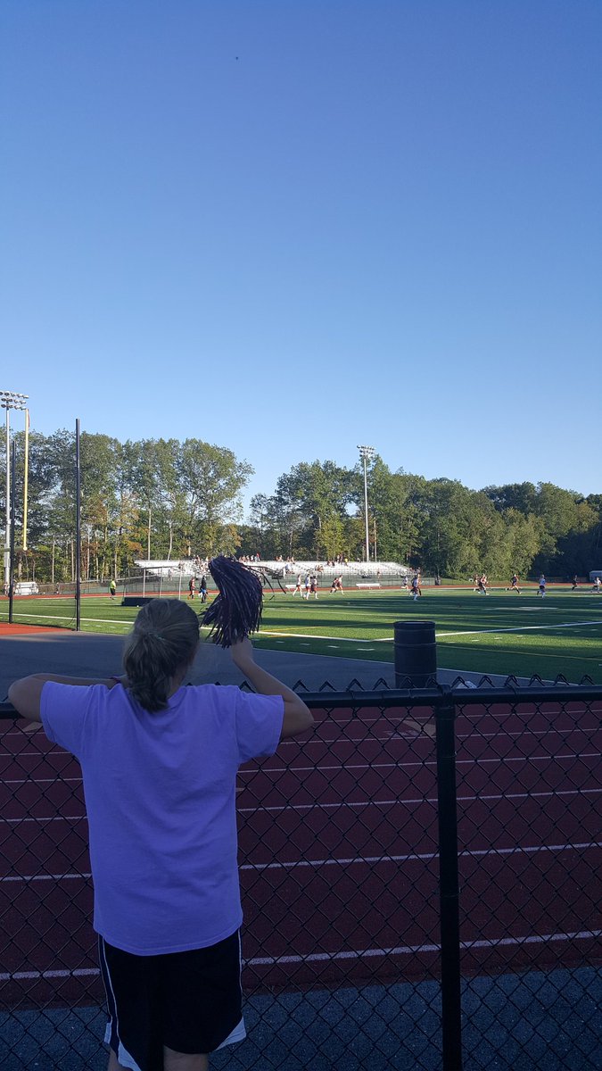 Molly cheering on the lady rams field hockey team