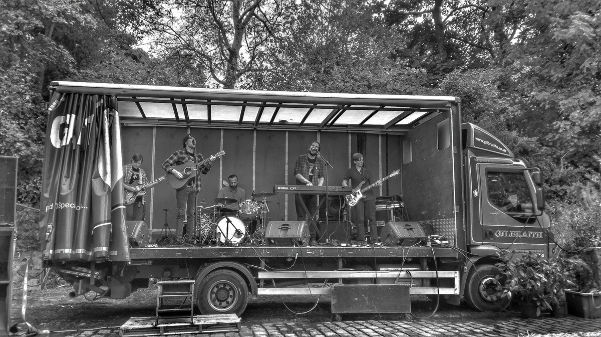 dbrereton's tweet image. Band on a truck @mlittlebrother at @_HarFest