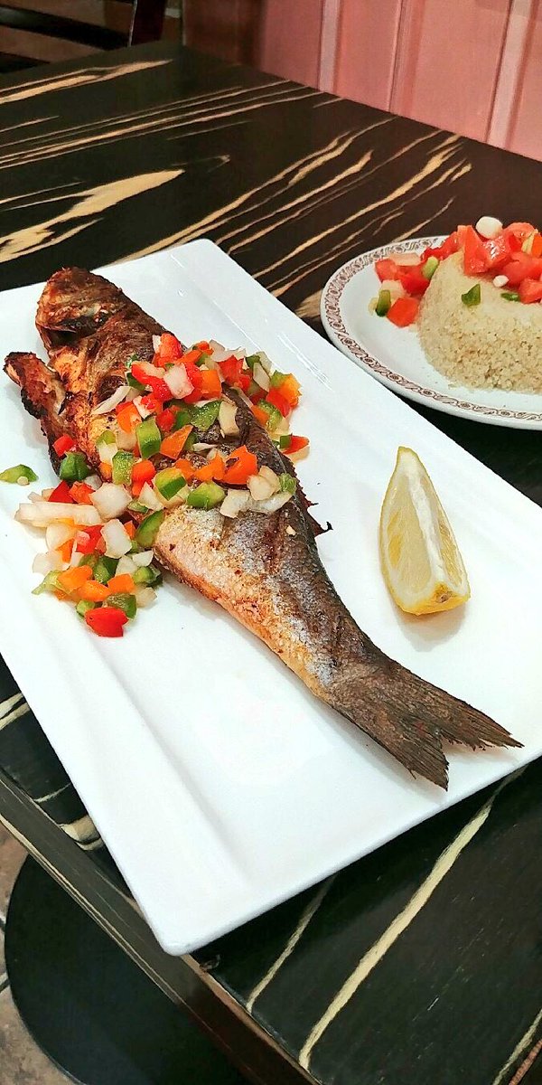 AFRICANVILLAGE4's tweet photo. Jollof, Grilled Sea bass. #Attiéké #AfricanVillage #Toronto https://t.co/2RqCMNHziv