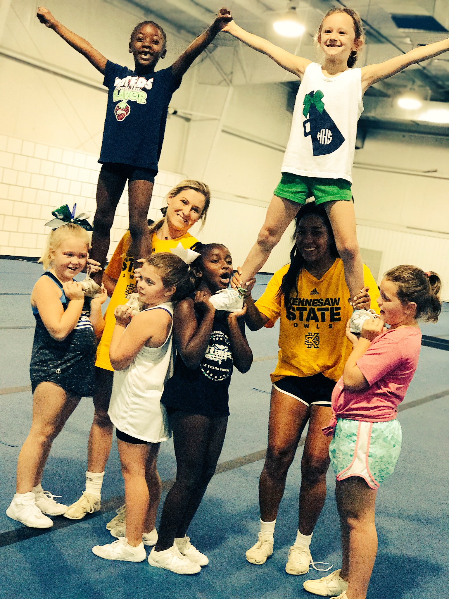 Kennesaw State Cheer on X: "Some of our clinic kids working on stunts!  There's still time to join us TOMORROW from 9-1! #hootyhoo 🦉  https://t.co/5pIHewDFYl" / X