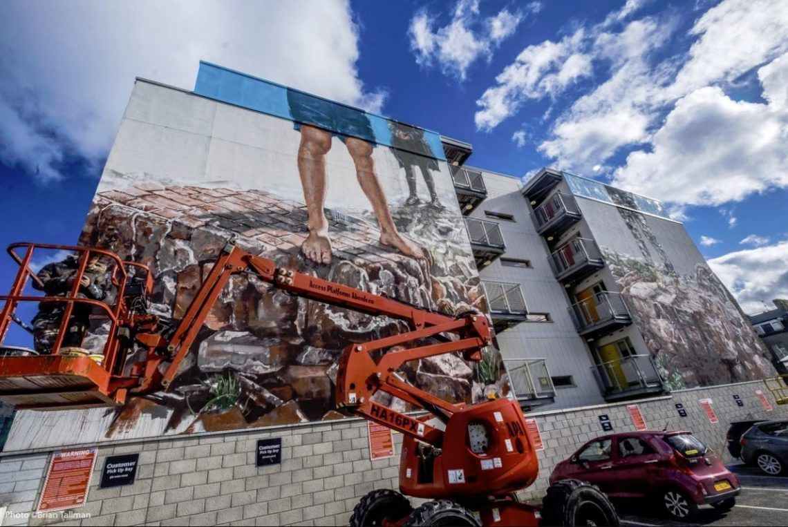 'The Broken Wall' by Fintan Magee in Scotland, a criticism of 'those who wish to build walls and devide us.'
