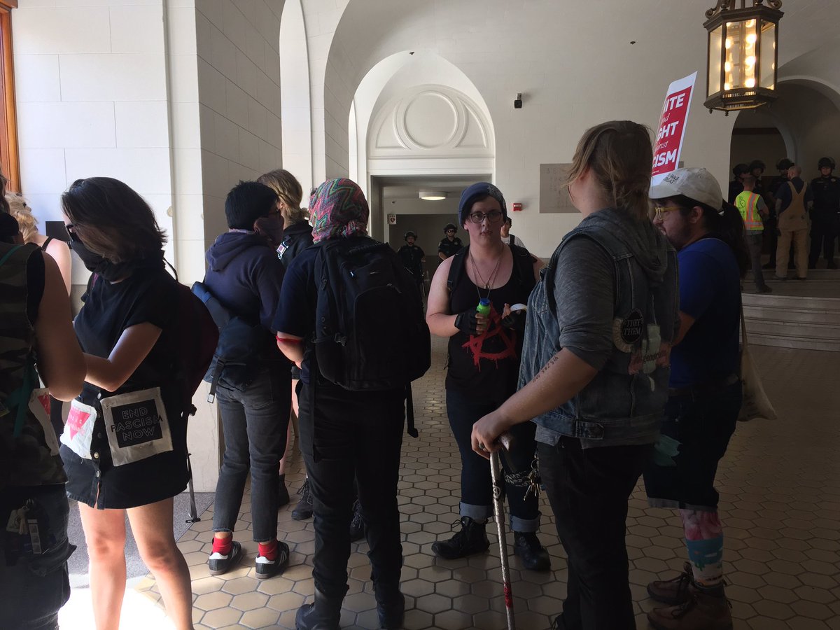 Some protesters still inside, sirens blaring.  Police presence at corridors and stairs.  <a href="/berkeleyside/">Berkeleyside</a>